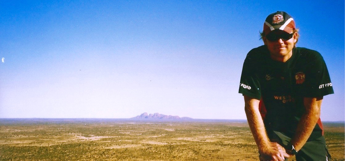 Lee on top of Uluru completing some of This Life List